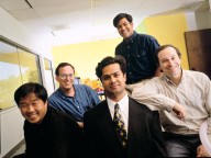 The co-founders of NetObjects (left to right in front row): Clement Mok, Samir Arora and David Kleinberg, along with Vice President of Business Development Tom Melcher (seated, second row) and Vice President of Product Development Sal Arora (standing, second row)., The co-founders of NetObjects (left to right in front row): Clement Mok, Samir Arora and David Kleinberg, along with Vice President of Business Development Tom Melcher (seated, second row) and Vice President of Product Development Sal Arora (standing, second row).