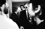 Author Tom Clancy (in glasses) and actor Tom Selleck (behind Clancy) at the Boston introduction of Newton., Author Tom Clancy (in glasses) and actor Tom Selleck (behind Clancy) at the Boston introduction of Newton.