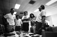 Apple Chairman John Sculley shares a laugh with Newton team members., Apple Chairman John Sculley shares a laugh with Newton team members.