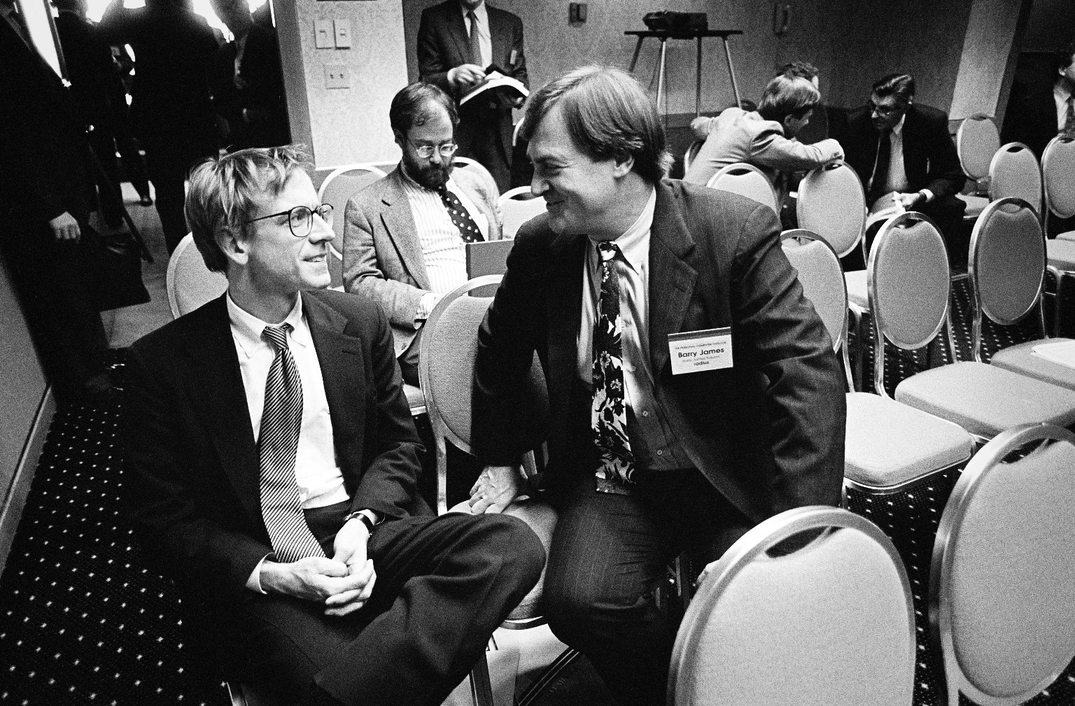 John Doerr, a Kleiner Perkins partner (left), in conversation with a colleague.